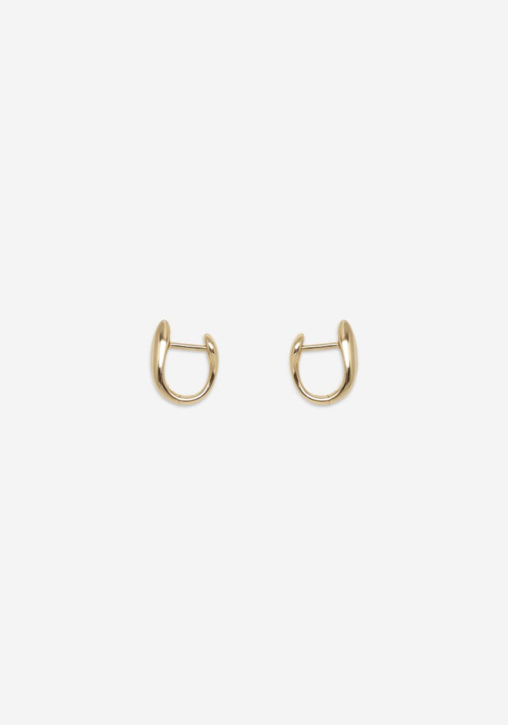 Nina Gordon Debut Hoops Gold huggie earrings on white background