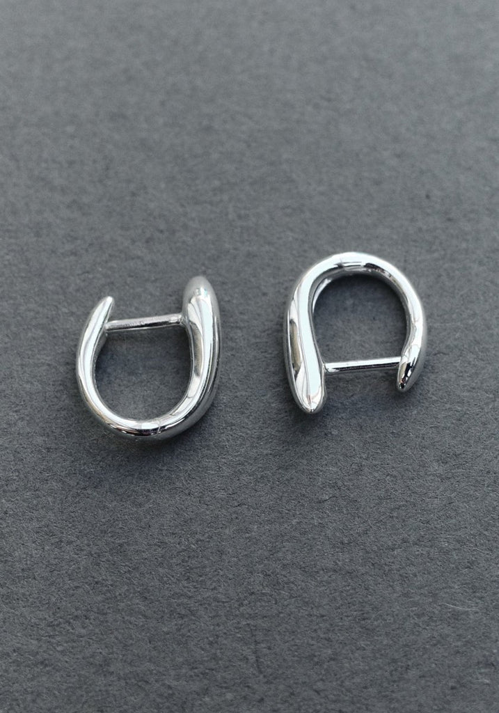 Nina Gordon Debut Hoops Silver flatlay on grey stone