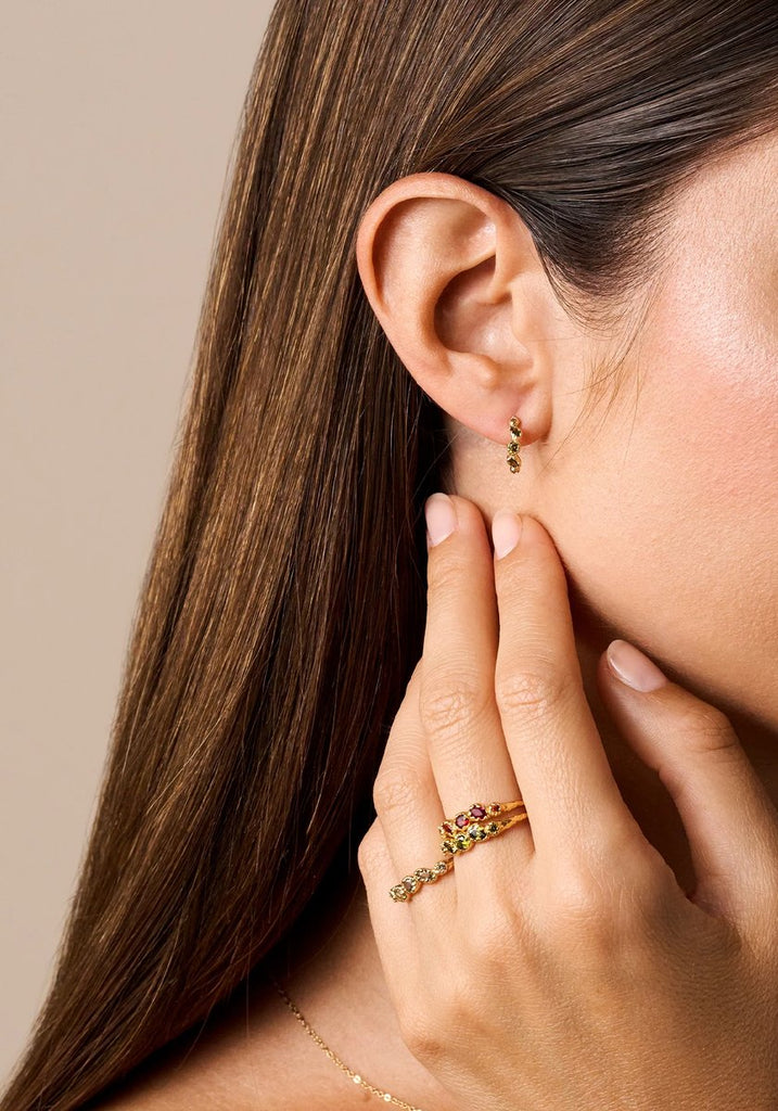 Agapée Koré Celadon Ring stacked with Koré rings and earrings on model