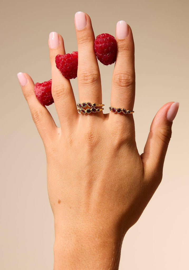 Agapée Koré Red Ring worn on hand, styled with raspberries