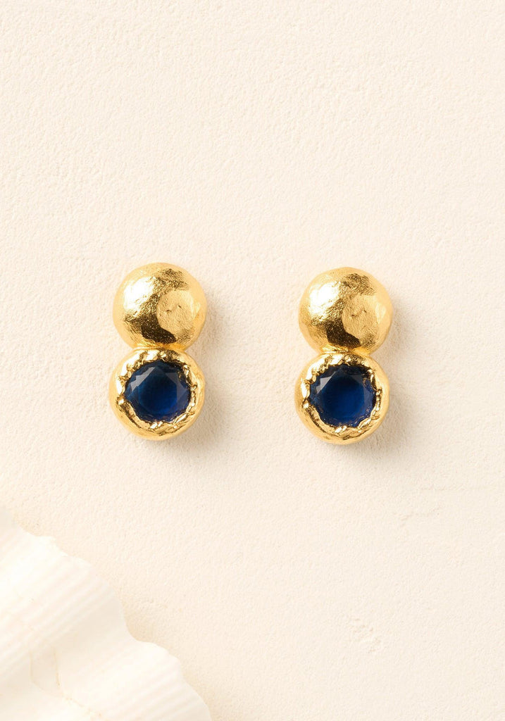 Agapée Petra Earrings, hammered gold studs with night blue stones
