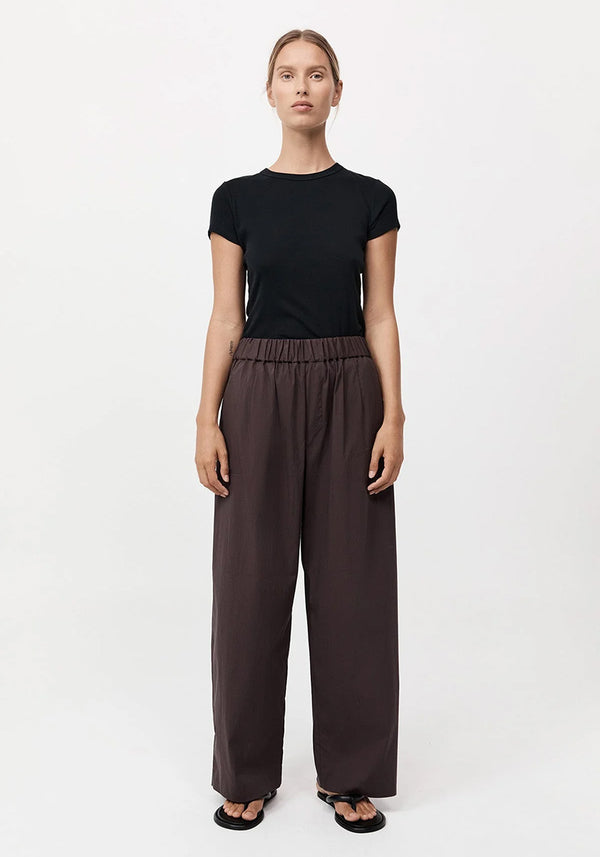 Woman Wearing Black Tshirt with Brown relaxed Mid Waist Pants