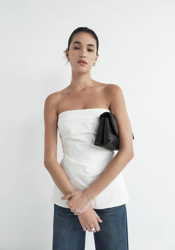 Woman Wearing White Structured Boob Tube Top with Jeans and Puff Bag