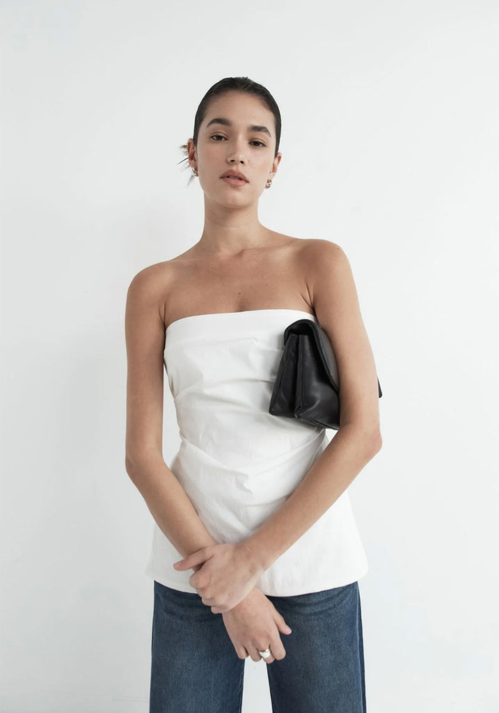 Woman Wearing White Structured Boob Tube Top with Jeans and Puff Bag